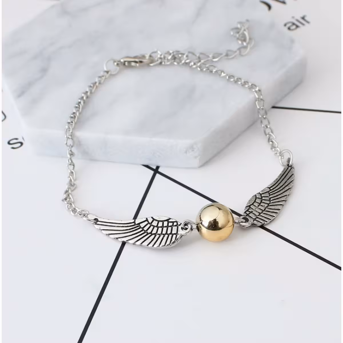 Srebrni dodatek s simboli Harryja Potterja